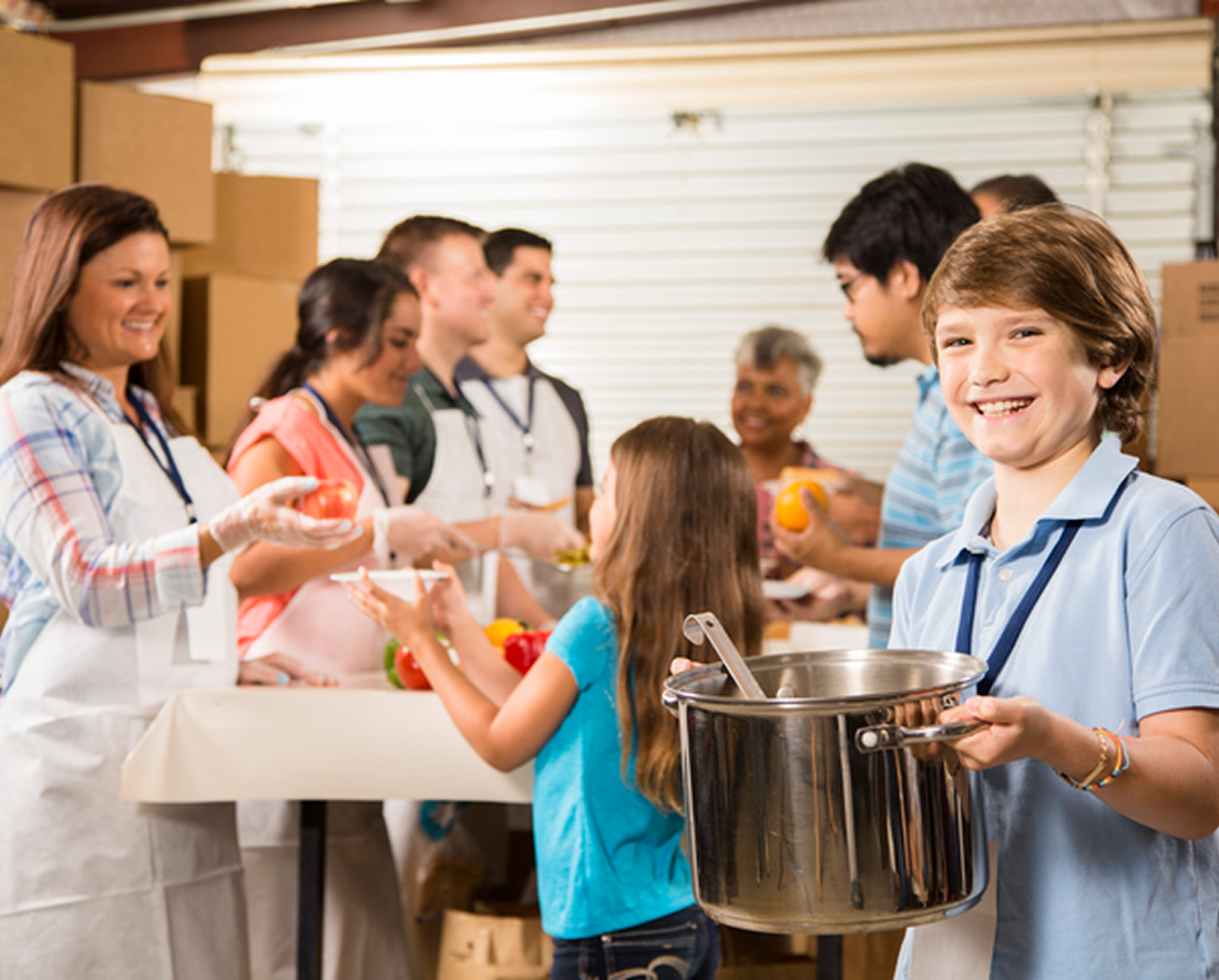 Volunteers serving food at community center